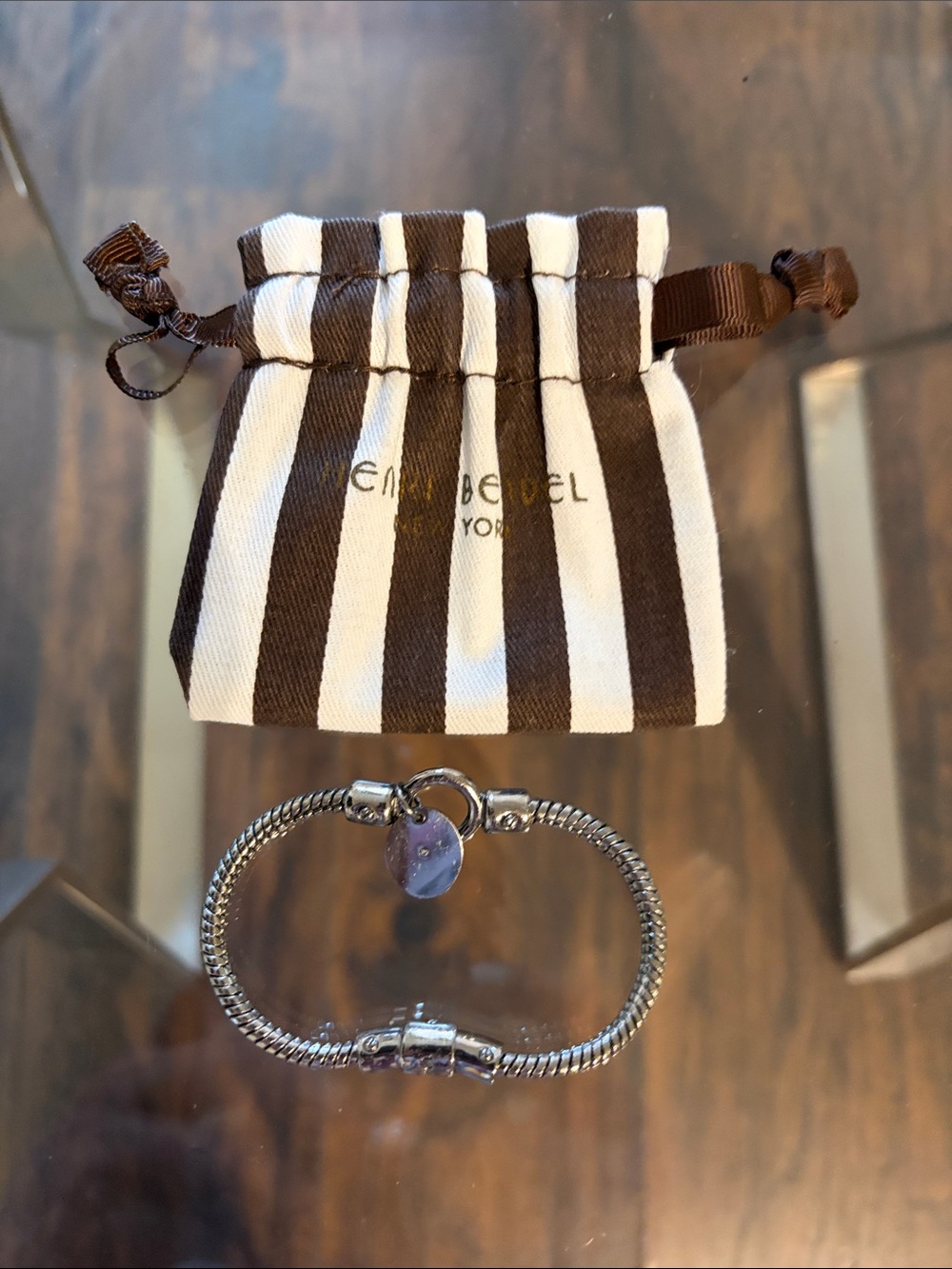 Henri Bendel Silver Chain Bracelet with silver charm.